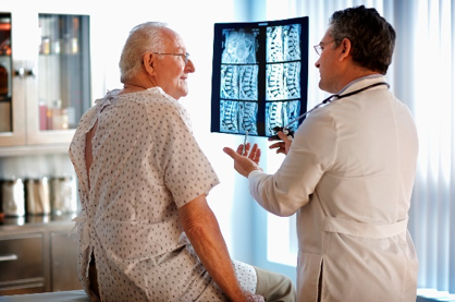 Doctor reviewing patient x-rays.